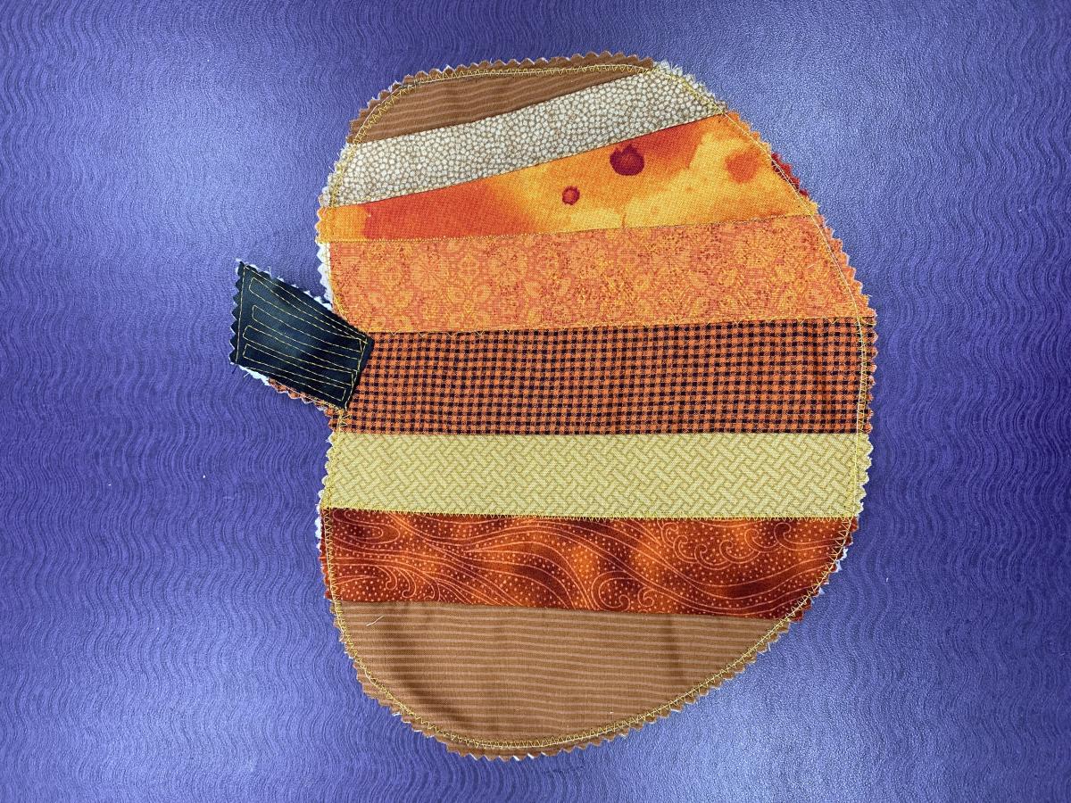 Learn some beginner quilting techniques while sewing this pumpkin!